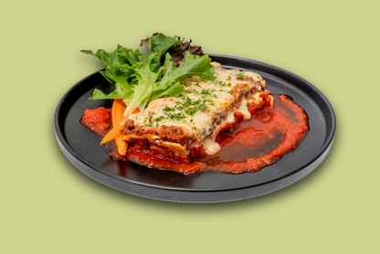 Frozen beef lasagna meal in tray, layered with beef mince, tomato sauce, and melted cheese