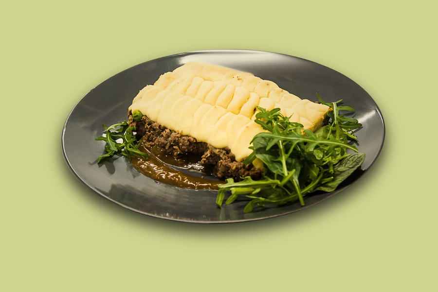 Plated cottage pie with golden mash top and savoury beef mince filling