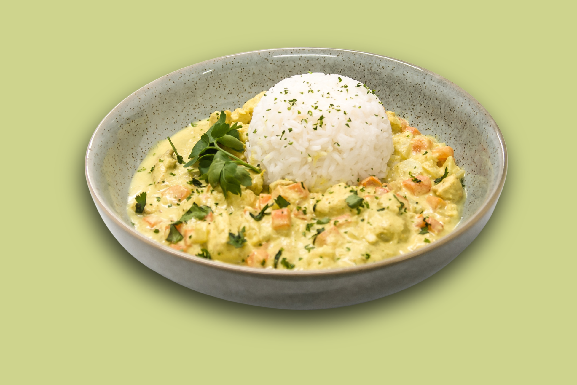 Plated island-style chicken curry with creamy coconut sauce, jasmine rice, and vegetables