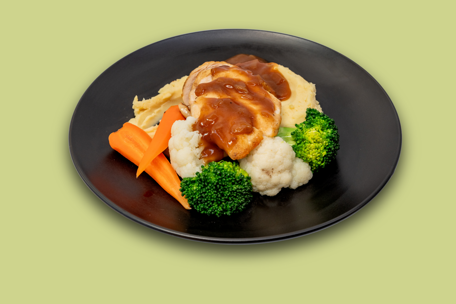 Frozen roasted chicken meal with mash, carrots, broccoli, cauliflower, and onion gravy