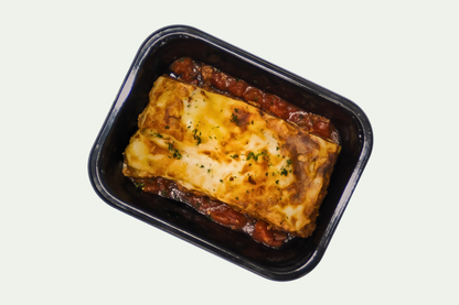Frozen beef lasagna meal in tray, layered with beef mince, tomato sauce, and melted cheese