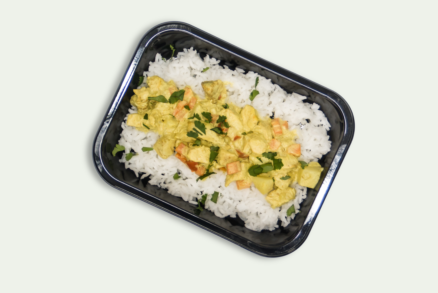 Frozen island chicken curry with coconut sauce, jasmine rice, carrots, and potatoes
