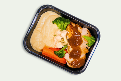 Frozen roasted chicken meal with mash, carrots, broccoli, cauliflower, and onion gravy